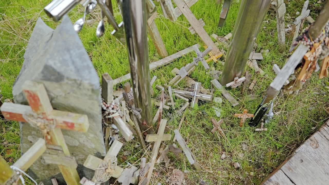 Wooden crosses at Hill of Crosses Lithuania symbolize devotion and resilience