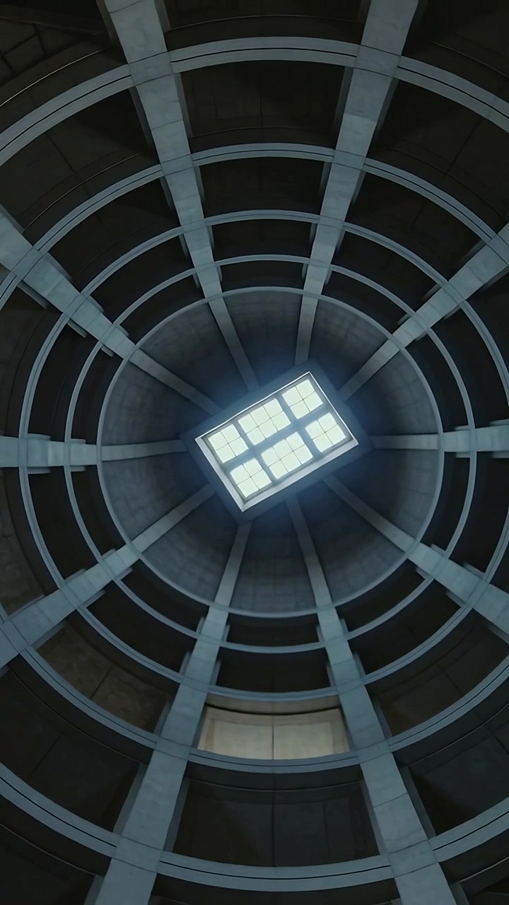 Vertical video: Rotating camera starting circling skylight, rings in atrium, showing recessed panel
