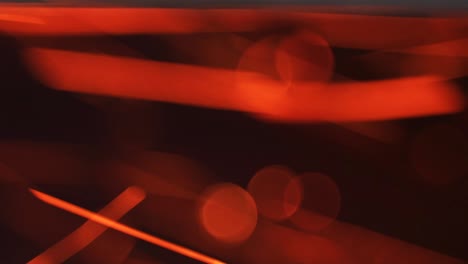 abstract decorative background. glowing fiery sparks. movement of red particles from fire in a black pipe