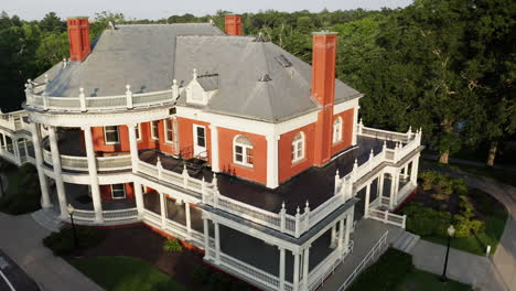 aerial view flying backwards, away from the roger williams park casino building