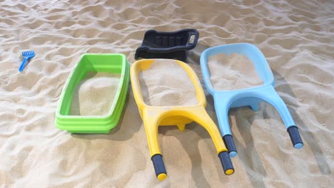 colorful sand toys in a sandbox