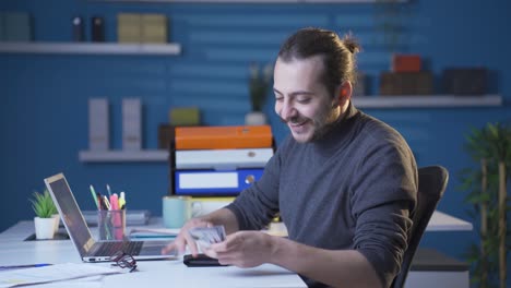 successful businessman making money is happy and joyful.