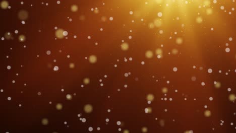 loopable slow motion golden bokeh lights and glowing particles on an amber background, festive and dreamy mood