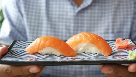 salmon sushi served on a plate