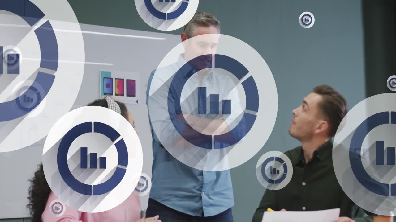 Animation of multiple bar graph icons floating over diverse colleagues discussing together at office