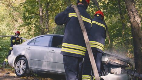 firefighters extinguish car fire
