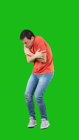 Man shivering and feeling cold on green screen