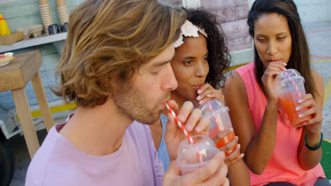 Happy friends having juice
