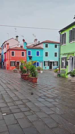 washing line across empty street of colourful painted houses slide vertical