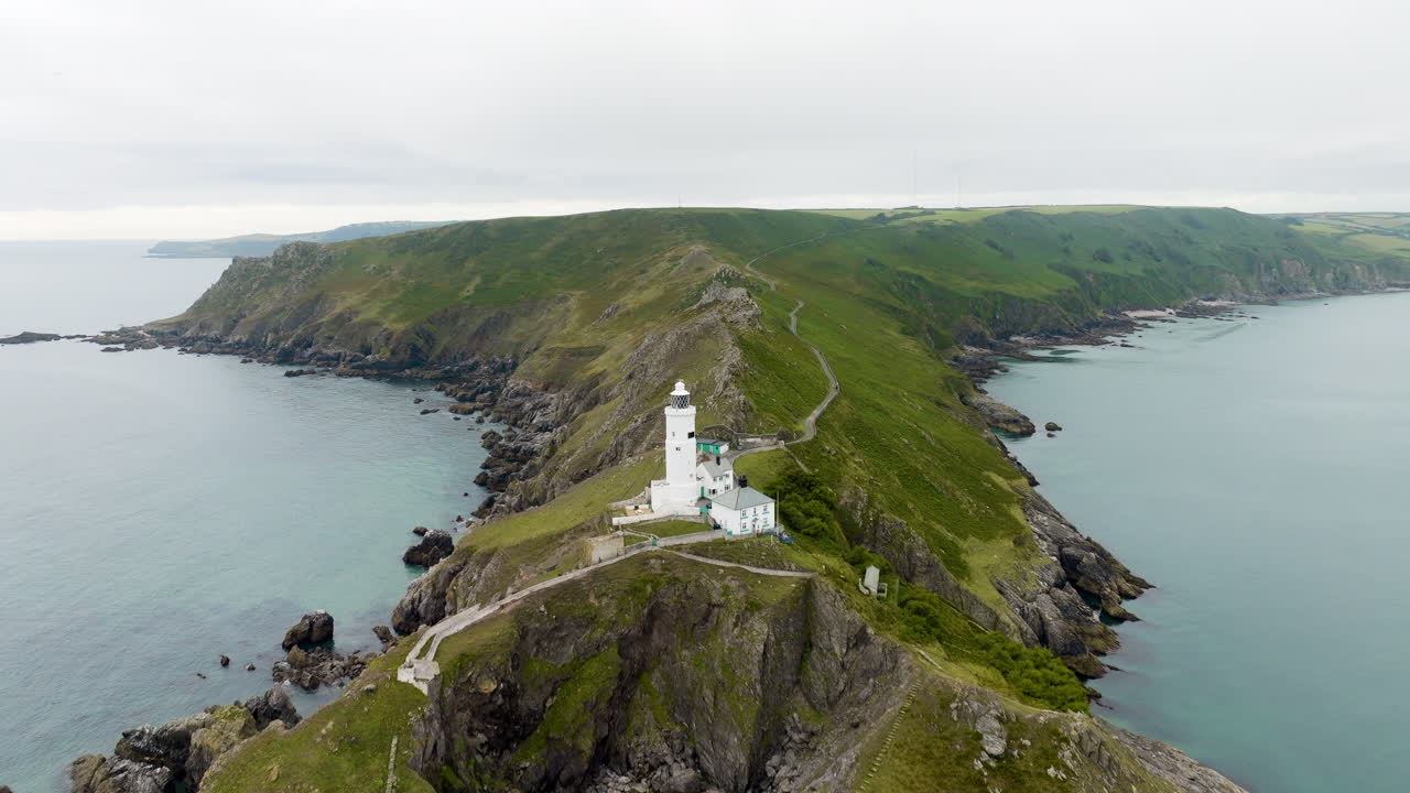 Aerial view of a lighthouse on a coastal cape