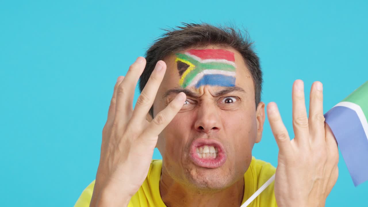 Man with south african national flag upset with a referee