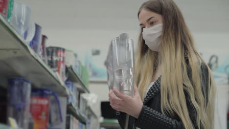 woman shopping for home appliances in a store