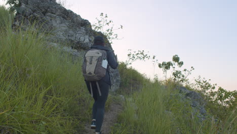 Young-Woman-Backpacker-Hiking-In-The-Mountains