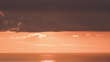 The-sun-sets-in-a-huge-orange-ball-in-time-lapse