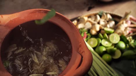 Steaming-hot-shrimp-soup-served-in-a-traditional-clay-pot,-capturing-the-essence-of-Thai-cuisine,-Close-Up