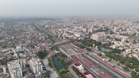 a sprawling railway terminal integrated into the urban fabric, surrounded by road networks