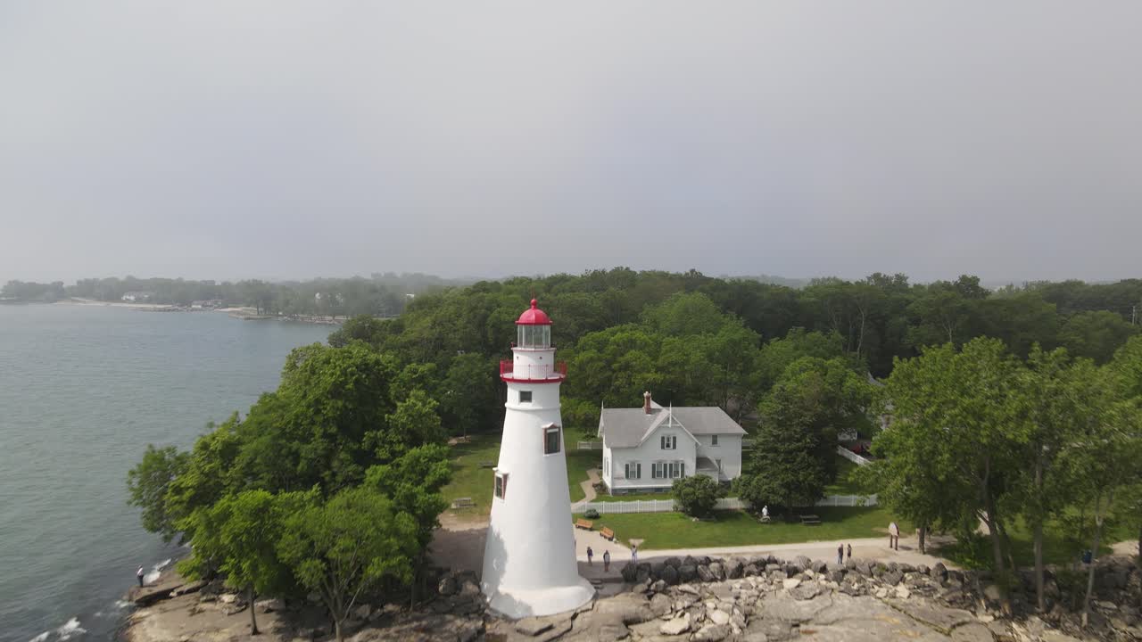 Marblehead Lighthouse along Lake Erie in Ohio drone shot moving in