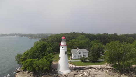 marblehead lighthouse along lake erie in ohio drone shot moving in