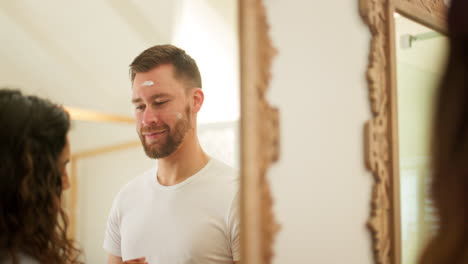 Face-cream,-skin-and-happy-couple-in-home-bathroom