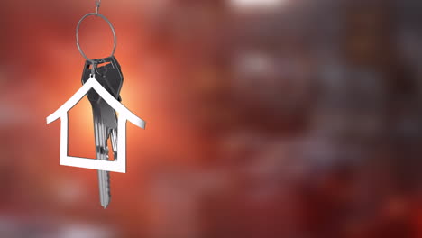 house-shaped keychain animation over blurred red background