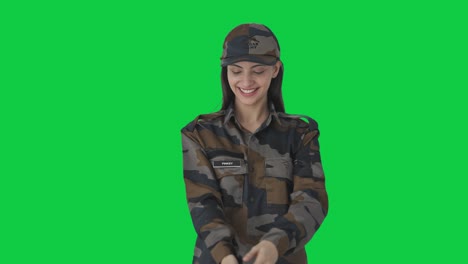 happy indian army officer wearing hat green screen