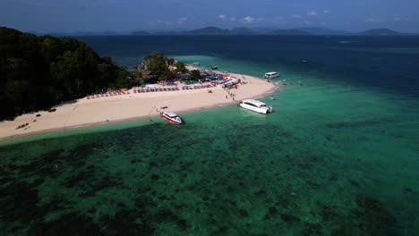 aerial view orbiting tourist boats moored at the ko khai nok isle, in thailand