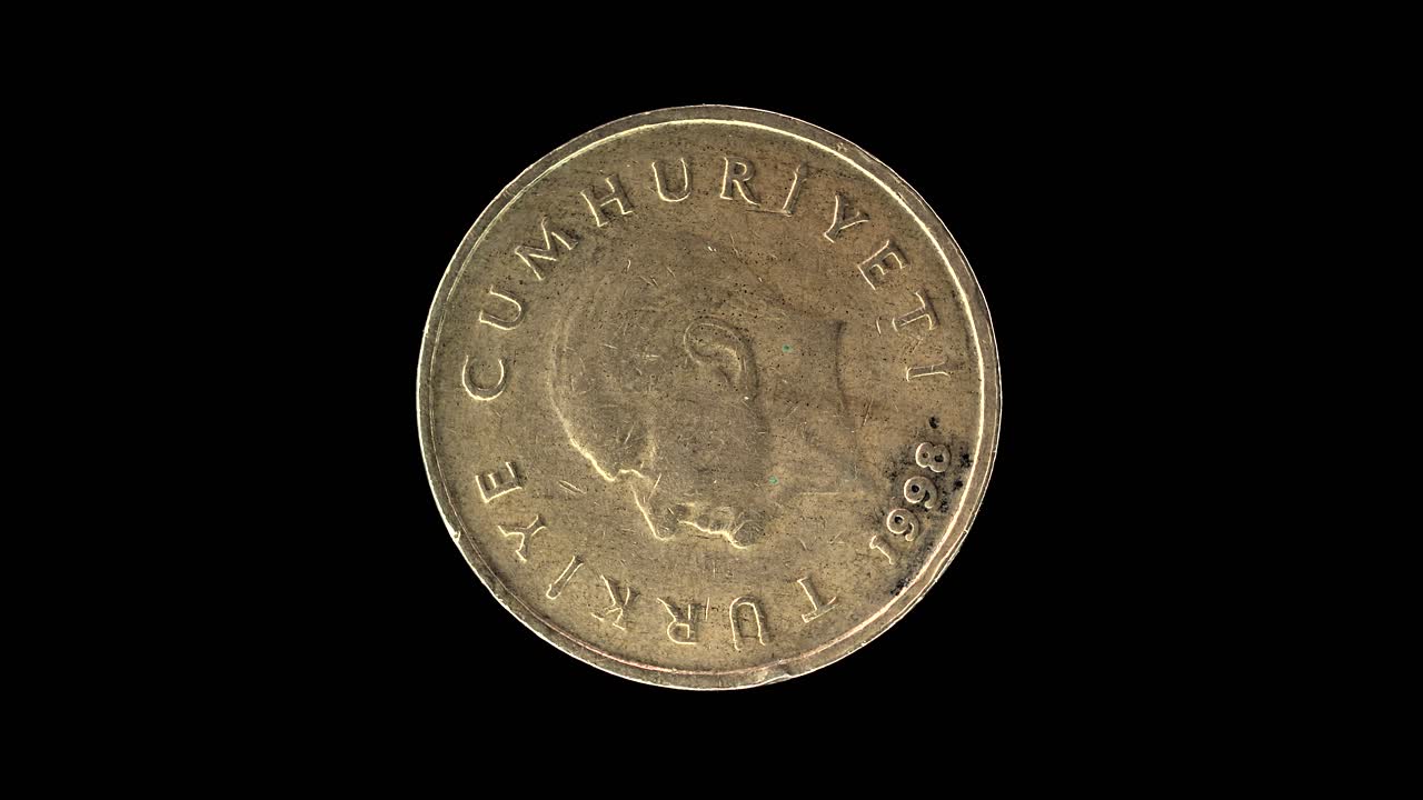 Turkey 1998 50 000 lira coin obverse with Atatürk portrait rotating on black background