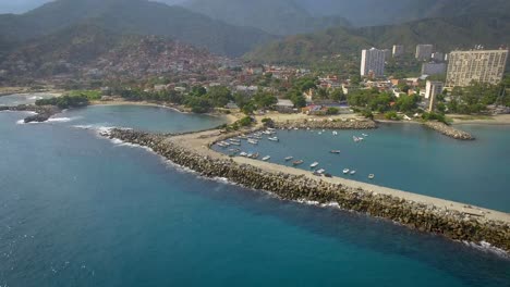 Drone-shot-view-of-the-breakwater-coastline-in-the-calm-Caribbean-Sea