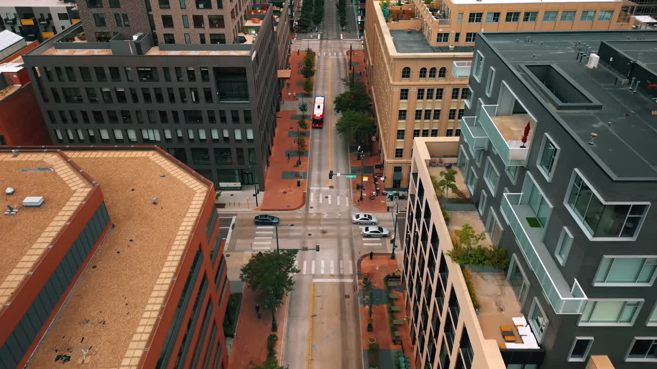 Traffic in the modern city. Cars and bus move by the roads in Denver, Colorado, USA. Aerial view