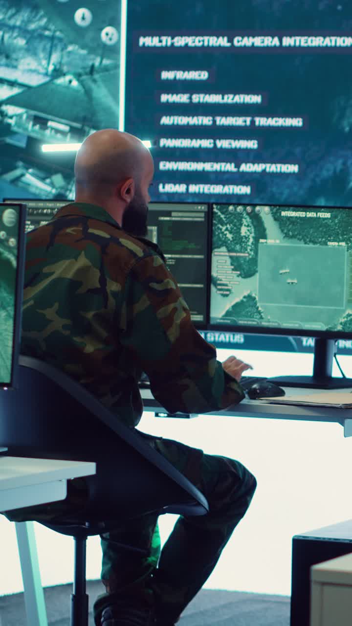 Military Man Monitoring Data in High-Tech Control Room