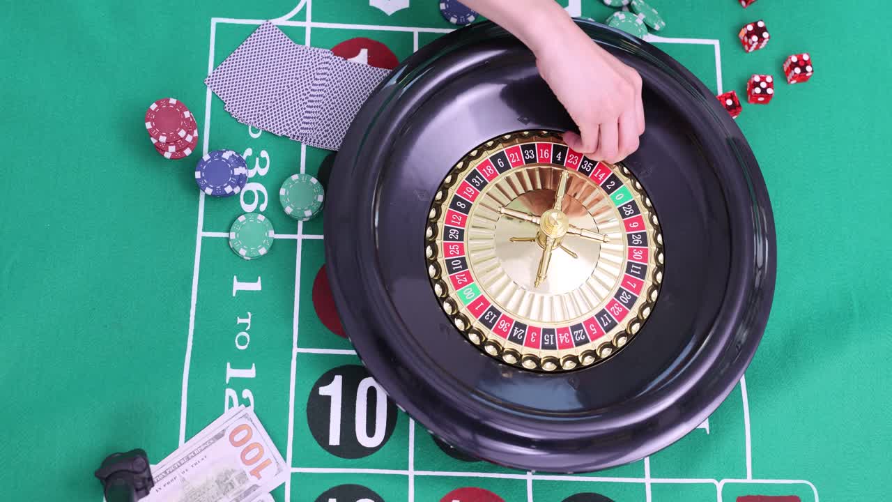 Roulette table with chips, cards, and money