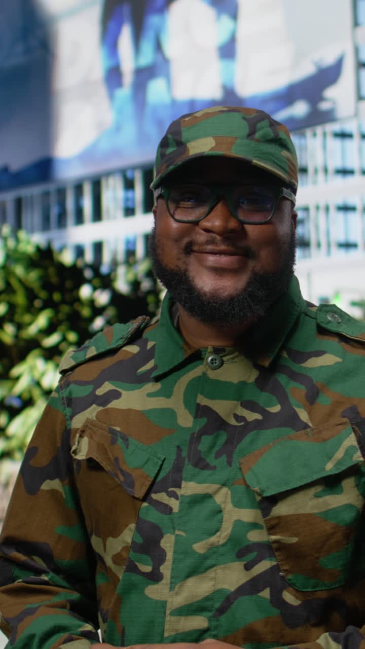 Vertical Video Confident african american soldier in uniform standing on a city street