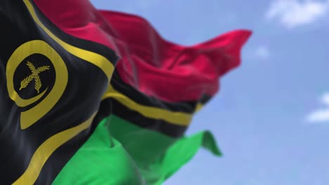 detail of the national flag of vanuatu waving in the wind on a clear day