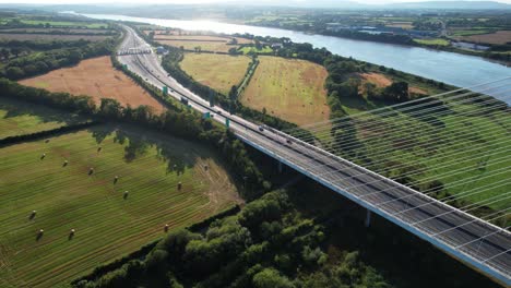 drone landscape suspension bridge traffic moving to and from tool booth waterford city bypass ireland summer evening