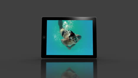 Media-device-screens-showing-girl-swimming