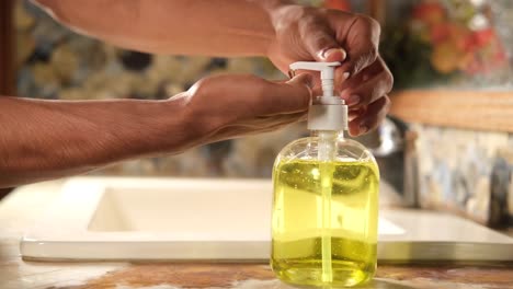 person washing hands with hand sanitizer