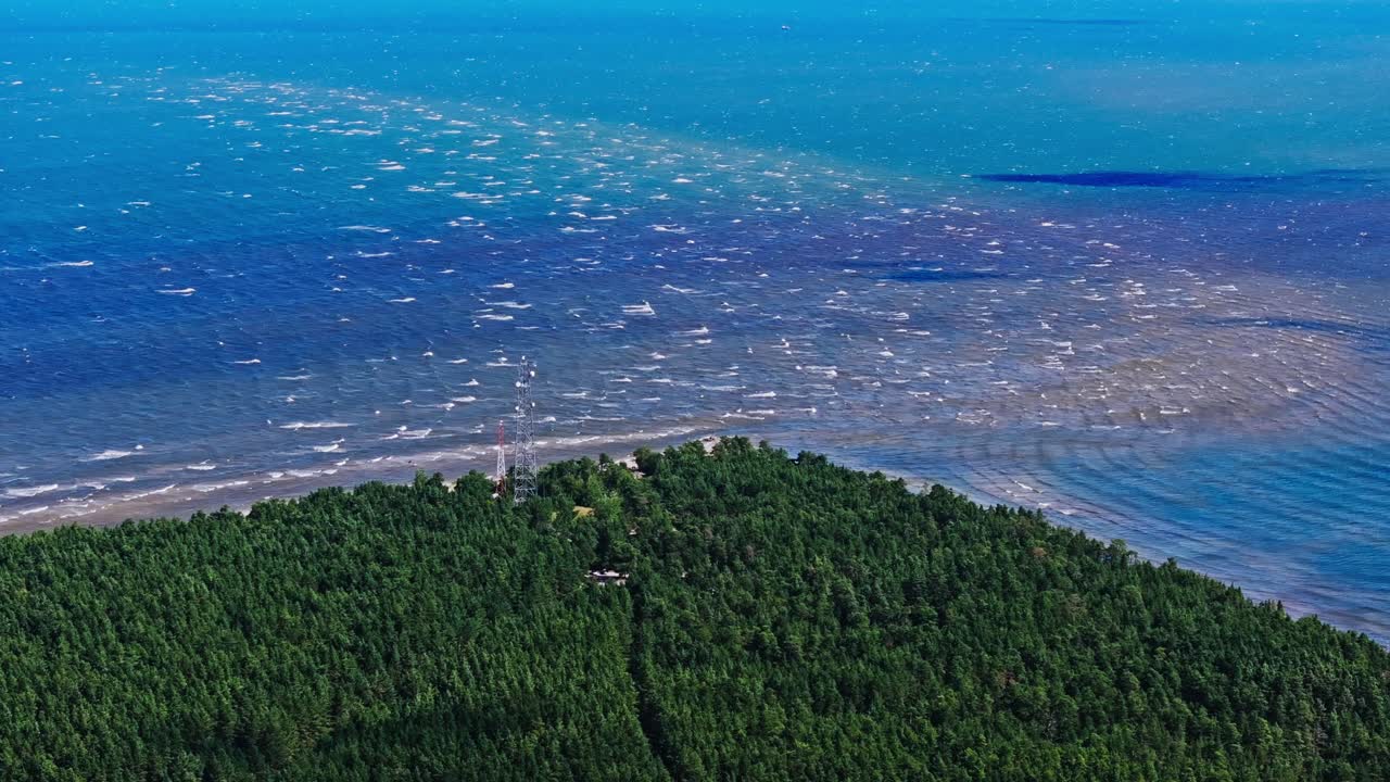 Drone shot of Kolka Cape showing sea currents merging in northern Latvia