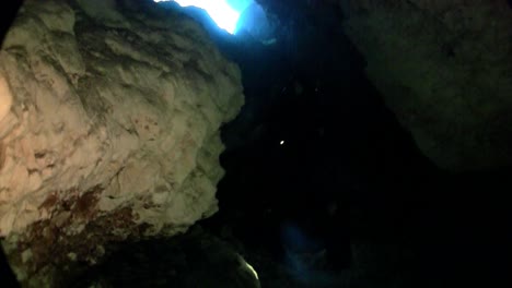 a scuba diver explores underwater caves in florida 2