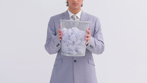 serious businessman holding a bin