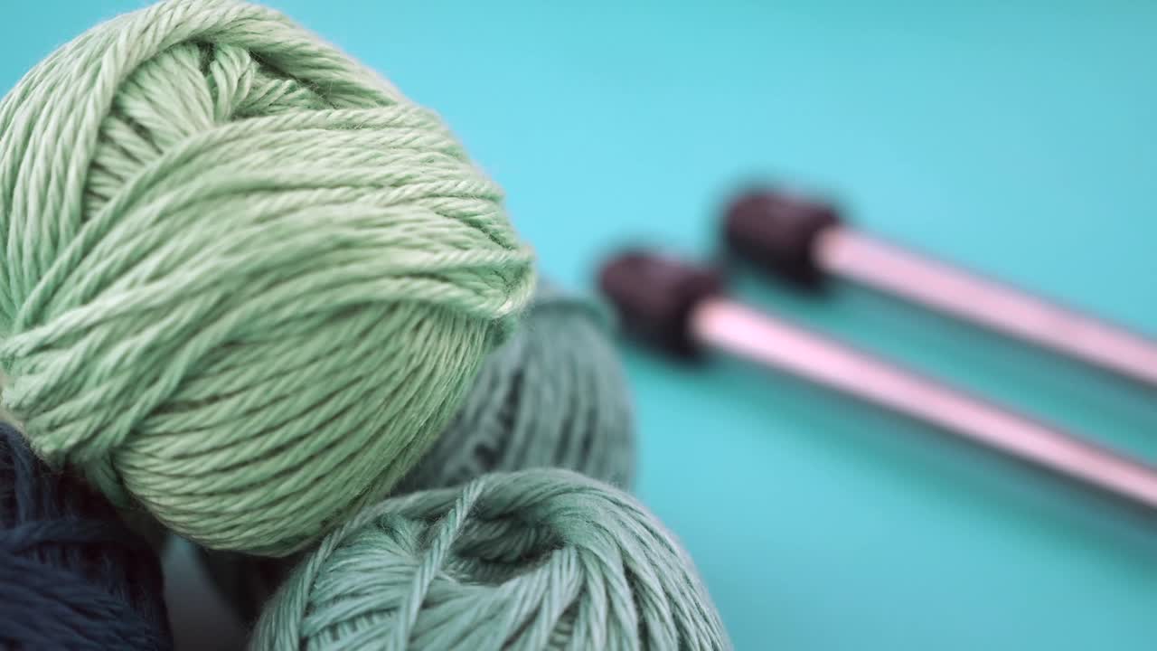 Balls of yarn and knitting needles