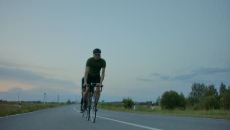 cyclists riding on country road