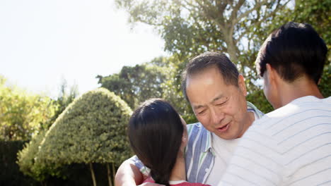 hugging and smiling, family enjoying quality time together outdoors