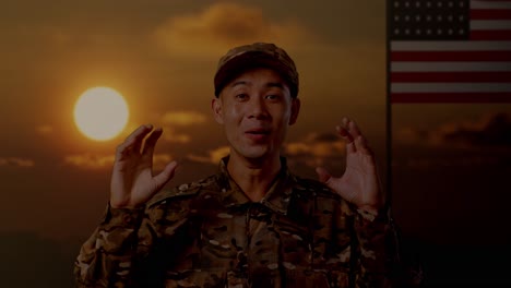 close up of asian man soldier smiling and saying wow while standing with flag of the united states, sunset time