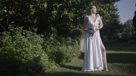 woman in a white dress in a garden