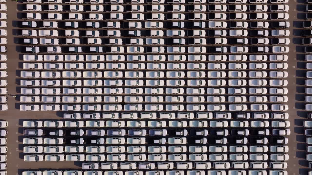 Vehicle inventory stacked at global trade port, Thailand