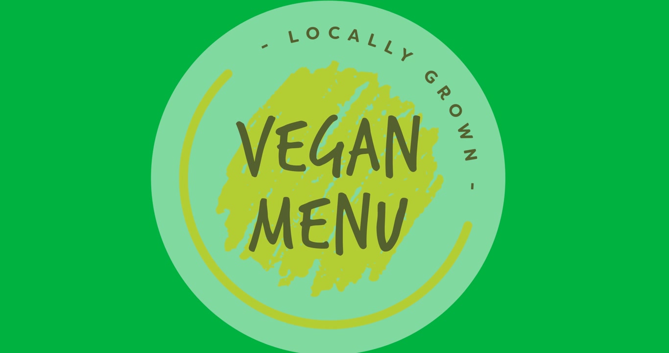 Digital animasjon av tekst for en lokalt dyrket vegansk meny over et grått rundt banner på svart bakgrunn