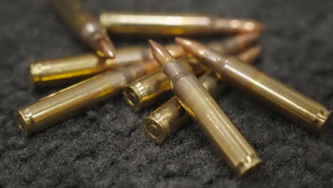 A-close-up-look-at-ammo-piled-on-a-black-carpet