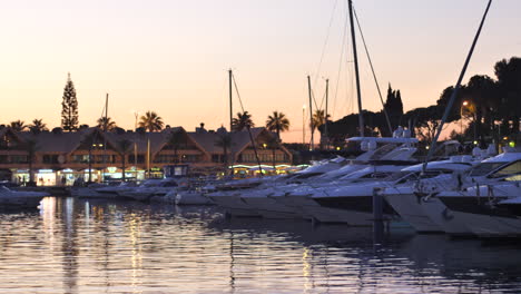 sunset scene with boats anchored in albufeira marina