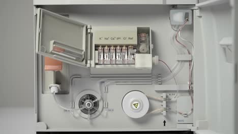 hand in glove opens locking device revealing electrodes in place