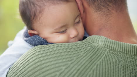 family, park and baby sleeping on his father